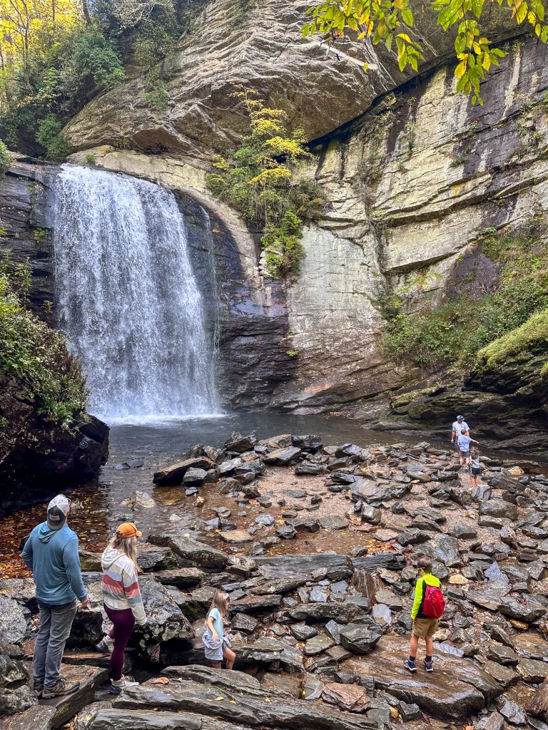 Waterfall with rocks and people in Pisgah National Forest, North Carolina, October 2025 Autumn