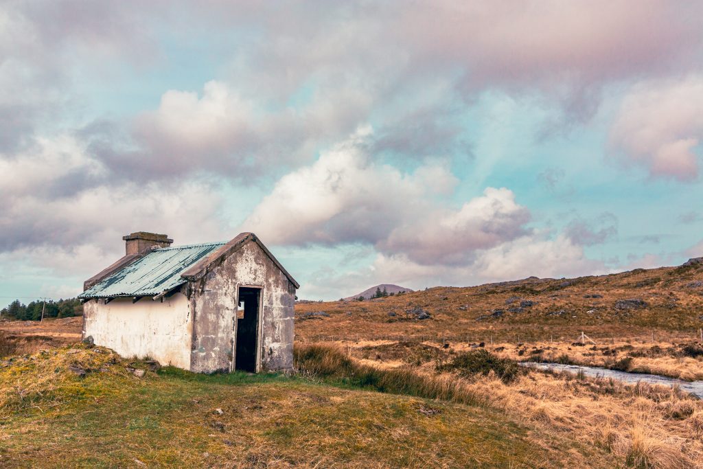 Abandoned white cottage with turquoise roof Connemara bog Ireland art print